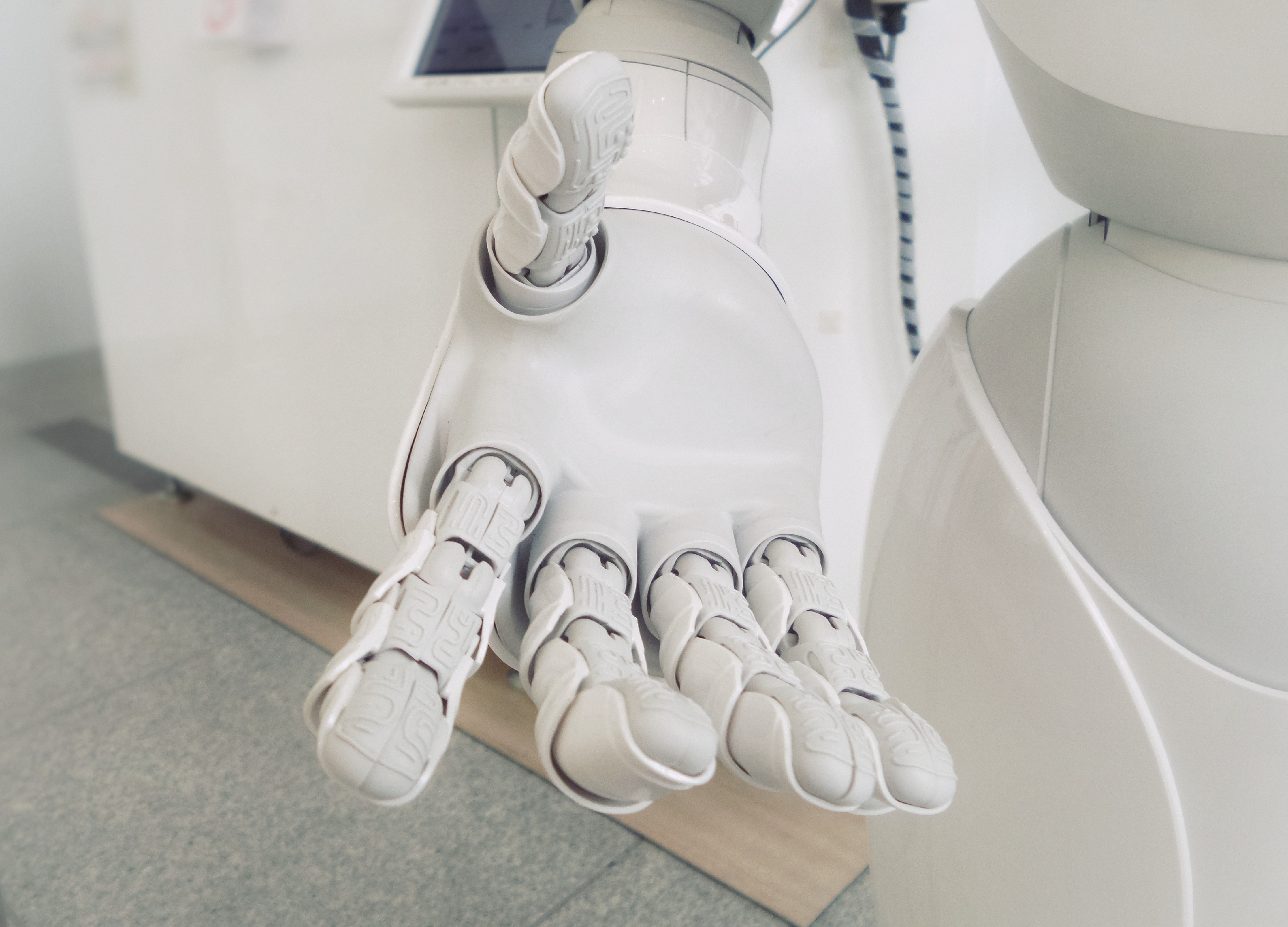 Robot arm reaching out AI